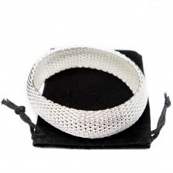 Women’s wide silver bangle bracelet with a mesh texture